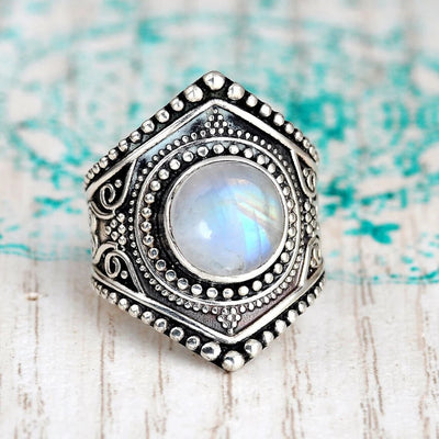 Antique silver hexagon moonstone-look cabochon ring on pale wood