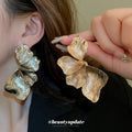Layered Flower Statement Earrings In Gold And Silver view 4