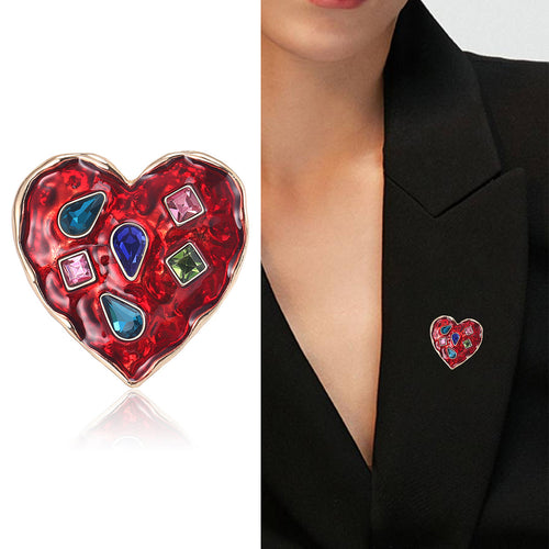 Jeweled Heart Brooch displayed in a styled setting