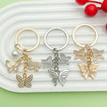 Butterfly Charm Keychains Featuring Silver Butterfly Across 34 Pictured Variations view 4