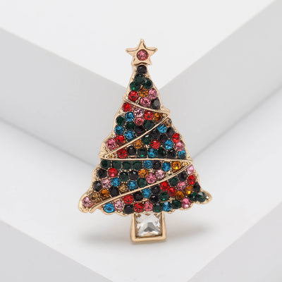 Front product view of the colorful crystal christmas tree brooch on a light background
