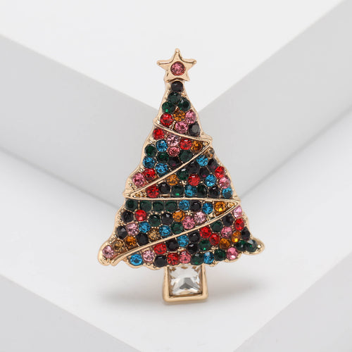 Front product view of the colorful crystal christmas tree brooch on a light background