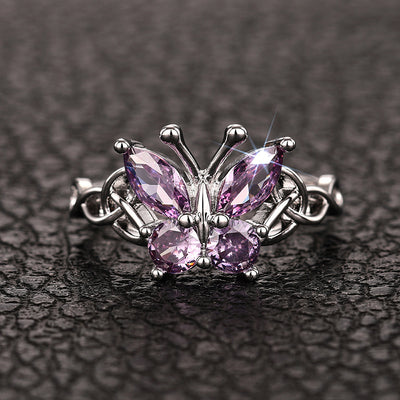 Product view showing silver-tone purple stone butterfly Celtic knot ring