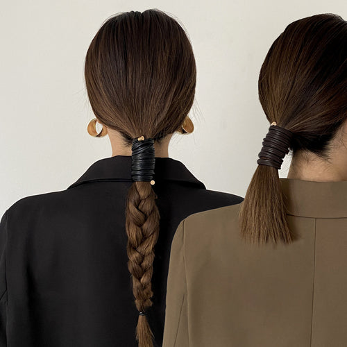 multi-loop leather-look ponytail wrap with gold-tone capped ends shown in the first close product view