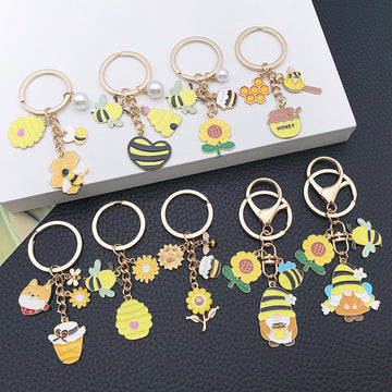 Seventeen Sunflower Bee and Gnome Metal Keychain Designs