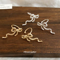 Minimal Ribbon Bow Ear Clips in Gold and Silver Tones view 2