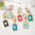 Gold Tone Wavy Rectangle Resin Evil Eye Clip Keychains in Six Colors view 1