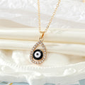 Gold Tone Crystal Teardrop Evil Eye Necklace and Earring Options view 10