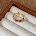 Four Mixed Red Enamel And Crystal Open Ring Designs In Gold Tone view 8