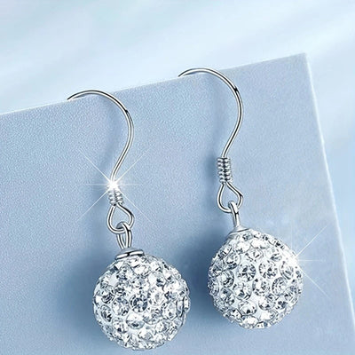 Silver crystal pave ball drop earrings on blue card