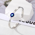 Gold Tone Slim Blue Evil Eye Open Cuff Bracelet with Polished Finish view 3