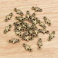 Tiny Double Loop Star Connector Charms in Two Finishes view 6