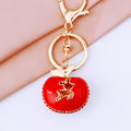 Jeweled Red Apple Keychain with White Deer Silhouette and Green Leaf view 4