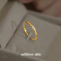 Gold Tone Slim Textured Band And Clear Square Stone Ring view 3
