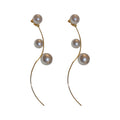 Curved Gold Tone Wire Earrings With Pearl Beads With Polished Metal Tone Details view 5