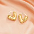Gold and Silver Tone Heart Huggie Earrings Polished Jewelry Accessory view 2