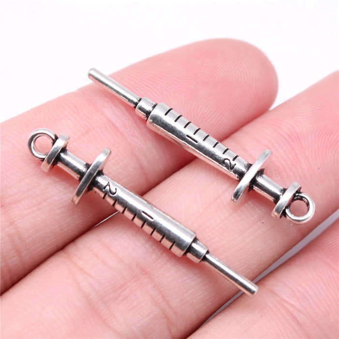 Syringe-Shaped Connector Charms in Four Metal Finishes