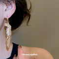 Gold Layered Feather Huggie Earrings with Cutout Details view 3