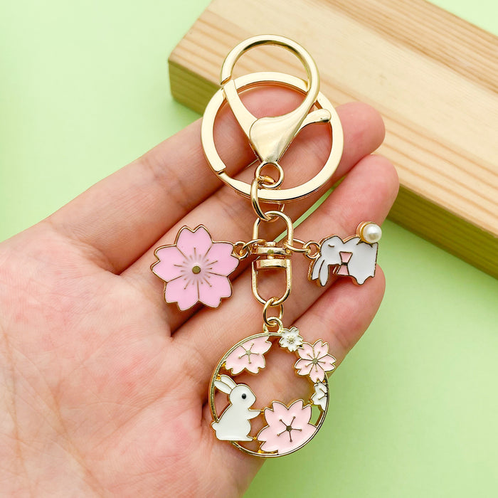 Cat Charm Keychains Featuring Pink Blossom Across 19 Pictured Variations