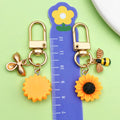 Bee and Honeycomb Charm Keychains Featuring Yellow Sunflower Across 25 Pictured Variations view 3