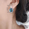 Blue Square Gem Butterfly CZ Stud Earrings Silver Tone view 4