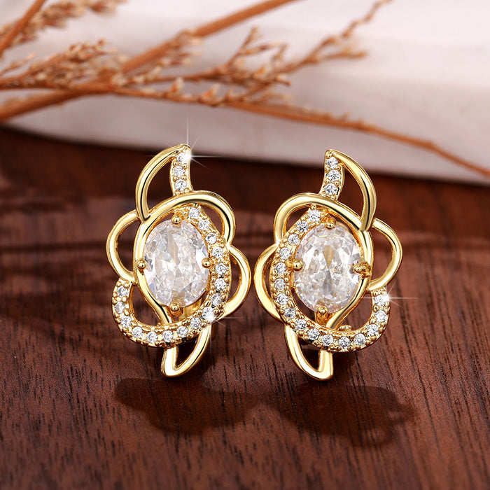 Gold Tone Floral Huggie Hoop Earrings With Clear Centers