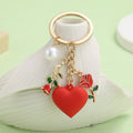 Red Heart Charm Keychains In 4 Rose, Butterfly, Tag And Pearl Styles view 1