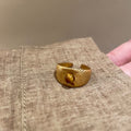 Three Gold Tone Brown Oval Round And Sunburst Stone Ring Designs view 7
