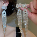 Crystal Bow Fringe Drop Earrings in Gold and Silver Tone view 2