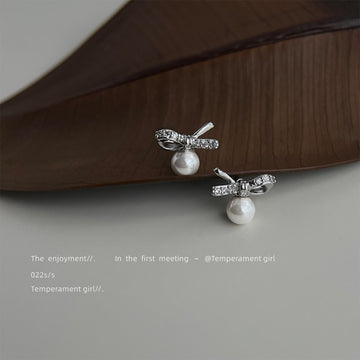 Silver Tone Clear Stone Bow And White Pearl Drop Stud Earrings