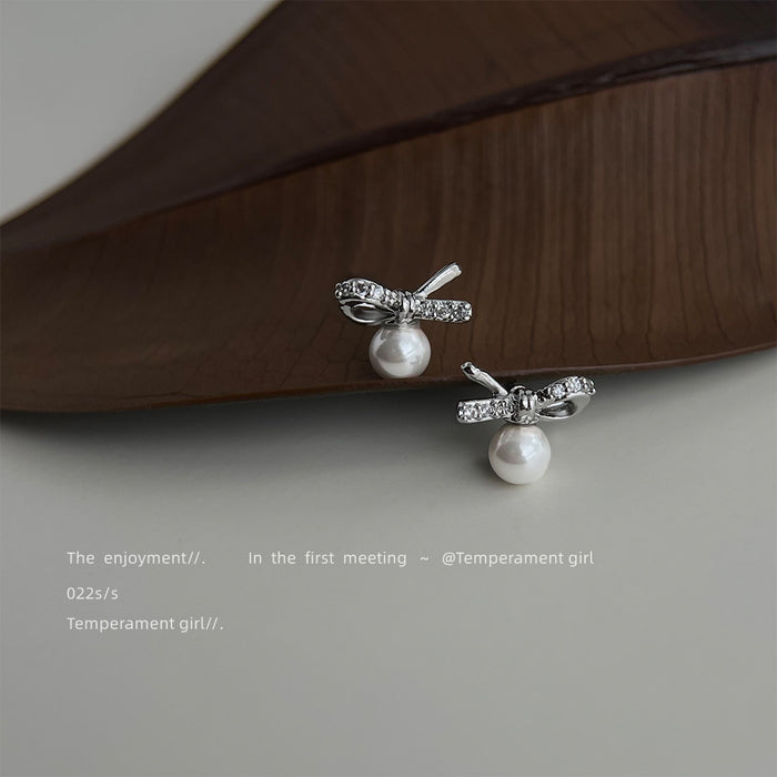 Silver Tone Clear Stone Bow And White Pearl Drop Stud Earrings