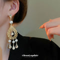 Gold Tone Openwork Teardrop Pearl And Crystal Tassel Earrings view 3
