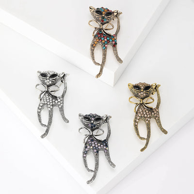 Front view of the long leg cat brooch with crystal bow decorative clothing pin on a white background
