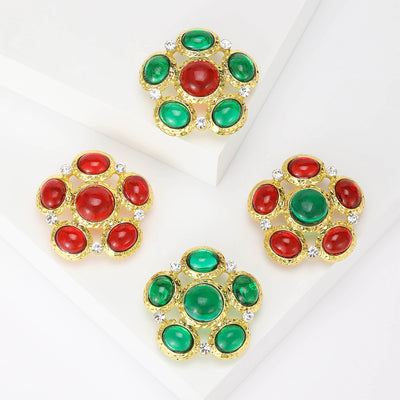 Front view of the oval stone cluster brooch showing a round gold-tone cluster of oval glass-look stones and clear crysta