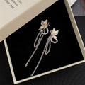 Gold and Silver Butterfly Pearl Look Chain Earrings view 3