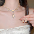 Gold Pink Cats Eye Oval Crystal Halo Necklace and Drop Earrings view 2