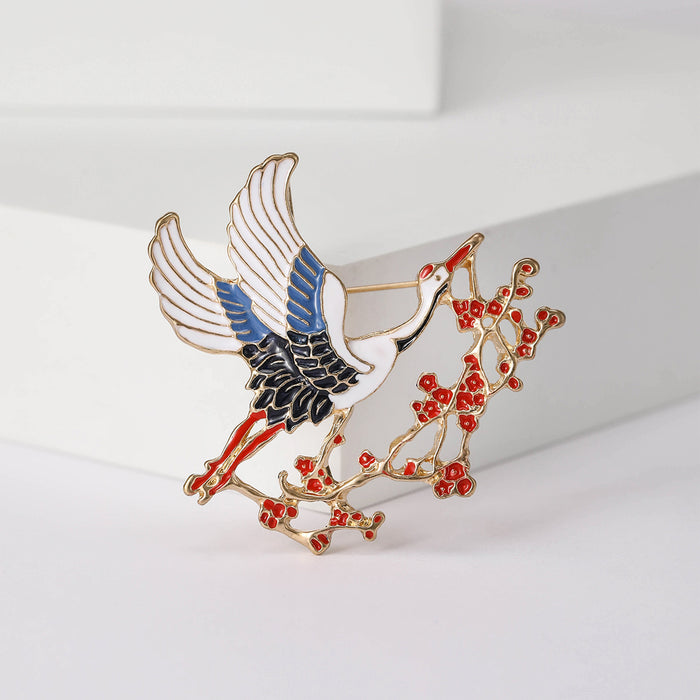 Crane and Blossom Brooch in Metal with Blue-winged Crane Perched on Red Flowering Branches