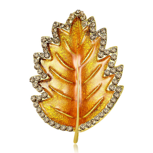 Yellow orange enamel leaf brooch crystal border studio shot