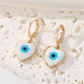 Gold Tone White Shell Round Heart and Hamsa Eye Huggie Earrings view 2