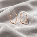 Rose Gold Diamond Cut Textured Thin Oval Hoop Earrings view 4