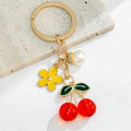 Red Cherry Charm Bag Keychain with Gold-Tone Hardware view 8