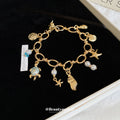 Seven Ocean Charm Bracelets With Starfish Shell Turtle And Whale Tail Details view 3
