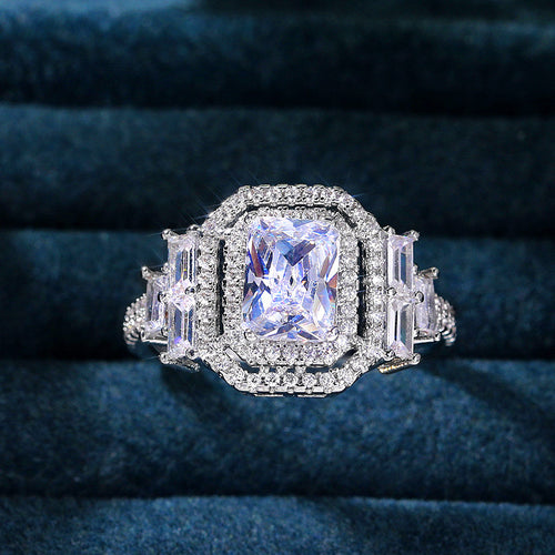 Angled detail of silver tone radiant cut crystal double halo ring statement jewelry