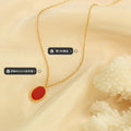 Red Oval Pendant Necklace Gold and Steel Frame Chain view 3