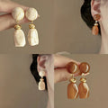 Marbled Geometric Resin Drop Earrings in Brown and Cream view 1
