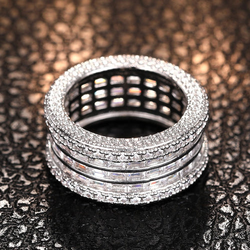 Front view of wide silver crystal band showing open lattice inside