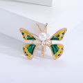 Butterfly Brooch In Metal With Green Or Red Enamel Wings And A Central White Faux Pearl view 4