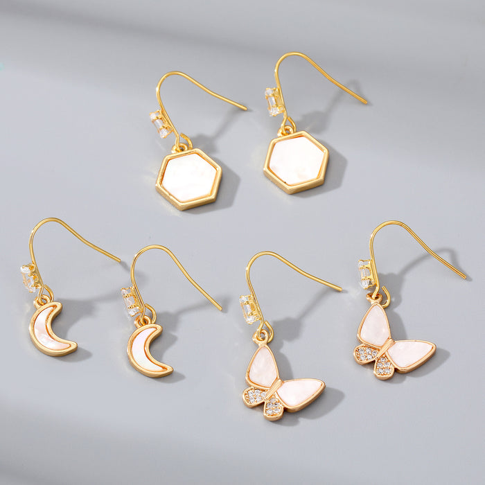 Gold Tone Long Crystal Hook Earrings with Geometric Charms