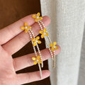 Yellow Flower and Pearl Chain Drop Earrings with Polished Metal Details view 1