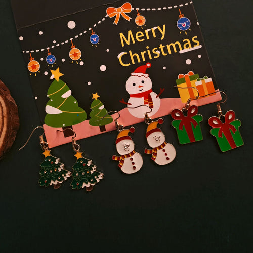 Tree snowman and gift box Christmas earring pairs on holiday card